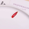 Elegant long red teardrop crystal pendant featuring gold-plated prong setting and loop - Red