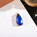 Deep blue teardrop crystal pendant in a gold-plated four-prong setting - 11x24mm Water Drop Single Pendant / Sapphire Blue