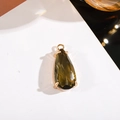 Faceted teardrop olive green crystal pendant with a gold four-claw setting - 11x24mm Water Drop Single Pendant / Light Gray