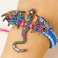 Vintage style fantasy dragon charm bracelet with colorful enamel and blue woven cord - Antique Gold-painted 9441