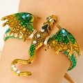Golden dragon enamel brooch pin with green wings and crystal details on a wrist - Antique Gold Green 9427