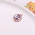 Elegant purple crystal oval pendant with double halo stones and gold plating - Purple