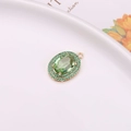 Oval light green crystal pendant with double halo green rhinestones and gold plating - Green