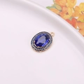 Oval dark blue crystal pendant with double halo blue pavé setting in gold finish - Sapphire Blue