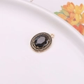 Oval black crystal pendant with double halo micro-pave rhinestones in gold setting - Dark Grey