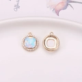 Mocha crystal round pendant with opal stone and zircon inlay in gold finish - Opal White (D6-724)