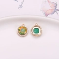 Golden round pendant with orange-green color-changing crystal and zircon halo - Orange (D6-720)