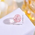 Macro detail of a 12mm faceted pink crystal bead with a center hole for DIY jewelry - Pink Ball Shape (D7-851)