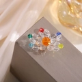 Detailed macro view of handmade crystal flower hair clip with multi-colored faceted beads - Six Color Flower