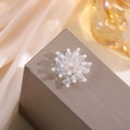 Macro shot of handcrafted white crystal and pearl flower beadwork for hair accessories - Artificial Pearl Flower