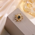 Macro detail of amber crystal flower hair clip with a vintage gold alloy base - Coffee Small Daisy
