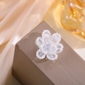 Detailed macro view of handmade layered white pearl and crystal beaded flower hair accessory - Small White Flower
