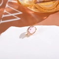 Detailed close-up of oval pink crystal earring component with gold plated setting - Pink