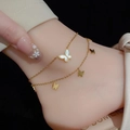 Close-up of double-layer gold butterfly anklet with white shell charm on the ankle - Double Layer White Shell Butterfly (233)