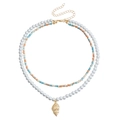 Bohemian double-layer necklace with white faux pearls and gold shell pendant detail - Conch Pendant