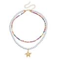 Double-layer colorful bead necklace with white imitation pearls and a golden starfish pendant - Starfish Pendant
