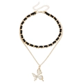 Gouden dubbellaagse choker halsketting met geweven ketting en witte vlinder hanger - Vlinderhanger