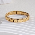 Italian style gold stainless steel link bracelet with engraved heart patterns on white props - Hollow Heart Full Gold (BD-33)