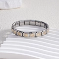 Italian modular stainless steel bracelet with gold double heart patterns at a 45-degree angle - Hollow Double Heart Center Gold (BD-216)