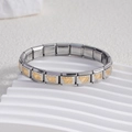 Detailed close-up of stainless steel Italian charm bracelet links with gold heart motifs - Heart with Double Arrow Center Gold (BD-240)