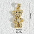 Macro view of a 18K gold teddy bear pendant with clear zircons and blue eyes detail - Bear Style (DZM-3690)