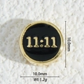 Macro detail of 10mm 18K gold plated 11:11 angel number charm with black enamel inlay - 11:11 Black Style (DZM-3699)