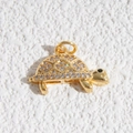 Macro shot of gold sea turtle pendant with sparkling cubic zirconia pavé detailing - Full Rhinestone Turtle Pendant (DYL-4620)