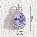 Macro shot of a purple teardrop crystal pendant showing dimensions 11.7mm by 7.0mm - Silver Base Purple Teardrop (DYS-5549)