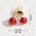 Macro shot of gold-plated cherry pendant with dimensions 13.0mm by 13.7mm and weight 1.9g - Single Cherry Style (DYS-5505)
