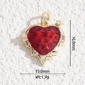 Macro detail of a 16mm red heart pendant with gold finish and zircon stones - Red Heart Style (DYS-5506)