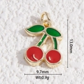 Cute red cherry pendant charm in gold plated brass with dimensions 13.0mm by 9.7mm - Cherry Style (DLD-5351)