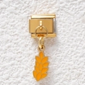 Detailed close-up of golden Italian charm bracelet link with yellow enamel wheat ear pendant - Golden Wheat (GMKDZ-499)