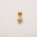 Macro view of a gold Italian charm featuring a floral design with purple gemstones - Purple Gem Flower Style (MKDZ-712)