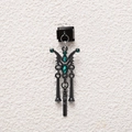 Macro detail of gothic black metal charm with green crystals and skeletal dangles - Green Wing Bone Style (MKDZ-793)