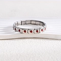 Macro shot of stainless steel modular bracelet with red enamel strawberry charms - Full Bracelet / Silver Strawberry Style