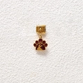 Detailed view of a gold modular bracelet link featuring a maroon paw print pendant - Reddish Brown Dog Head Silhouette Paw Print Style (GMKDZ-565)