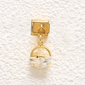 Detailed view of a gold dolphin charm with a faceted crystal on a stainless steel link - Dolphin Crescent Stone Style (MKDZ-864)