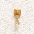 Detailed close-up of a gold-plated stainless steel charm with pear-cut cubic zirconia - Pear Cut Transparent Stone Style (MKDZ-868)