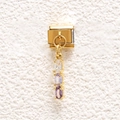 Macro detail of gold-plated stainless steel charm with triple oval purple gemstones - Purple-White Triple Oval Stone (MKDZ-843)