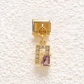 Macro detail of Italian charm bracelet link with gold plating and purple zircon stone - Purple Rectangular Stone Style (MKDZ-846)