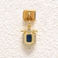 Macro shot of gold Italian charm with rectangle blue gemstone and white pavé crystals - Dark Blue Shield Stone Style (MKDZ-851)