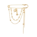 Golden safety pin brooch with heart and star pendants featuring elegant layered chains - Zw2476