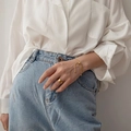 Minimalist 18K gold snake chain bracelet and broad ring set for women in lifestyle view - Adjustable Bracelet (567) / Gold