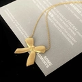 Elegant gold bow necklace with horizontal wavy texture and fine cross chain on card - Gold Necklace (86455)