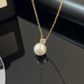 Elegant gold titanium necklace featuring a white pearl and sparkling zircon pendant - Zirconia Artificial Pearl Necklace (H1024) / Gold