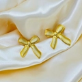 Detail of 18K gold bow stud earrings with a unique textured silk finish on satin - Bowknot Stud Earrings / Gold