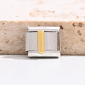 Detail of Italian charm bracelet link with polished silver and gold rectangular inlay - Letter I