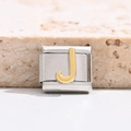 Detail of DIY Italian charm link in stainless steel with golden letter J engraving - Letter J