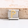 Macro shot of Italian charm bracelet link featuring a gold P letter on stainless steel - Letter P