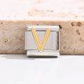 Macro detail of Italian modular charm featuring a golden letter V on stainless steel base - Letter V